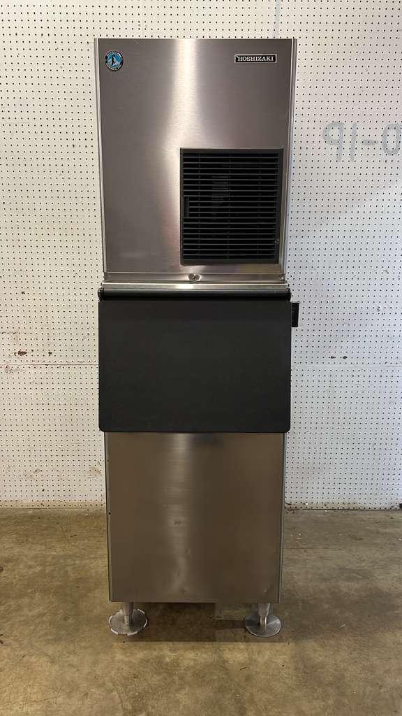 Light commercial ice machine being sanitized in a Utah showroom.