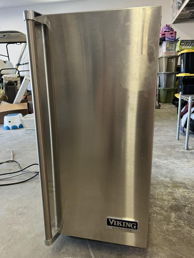 Residential undercounter ice machine being sanitized in a Utah home.