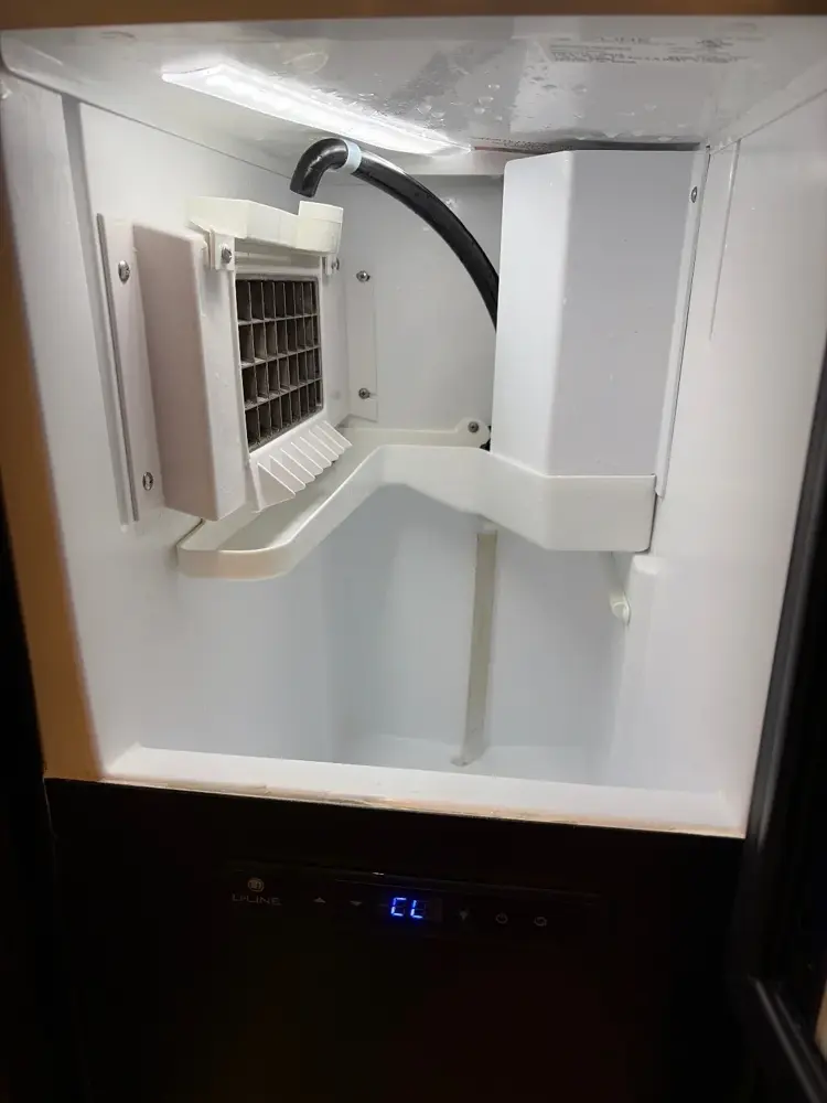 U-Line undercounter ice machine ice grid and chute, cleaned, Lehi, Utah.